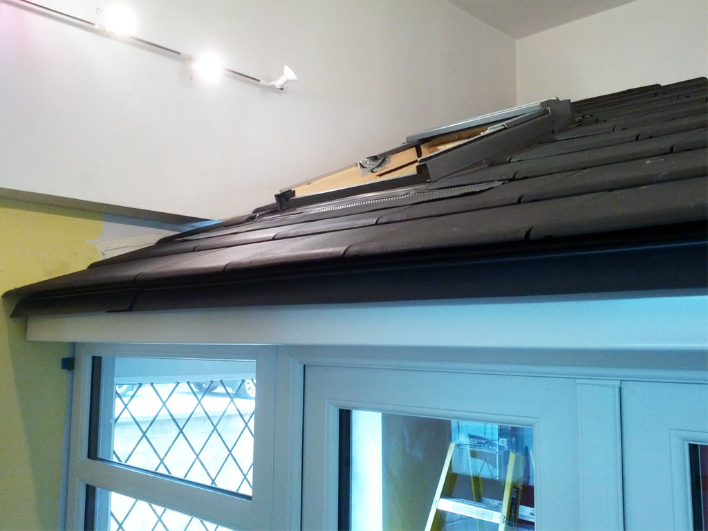 The roof cladding with the velux window